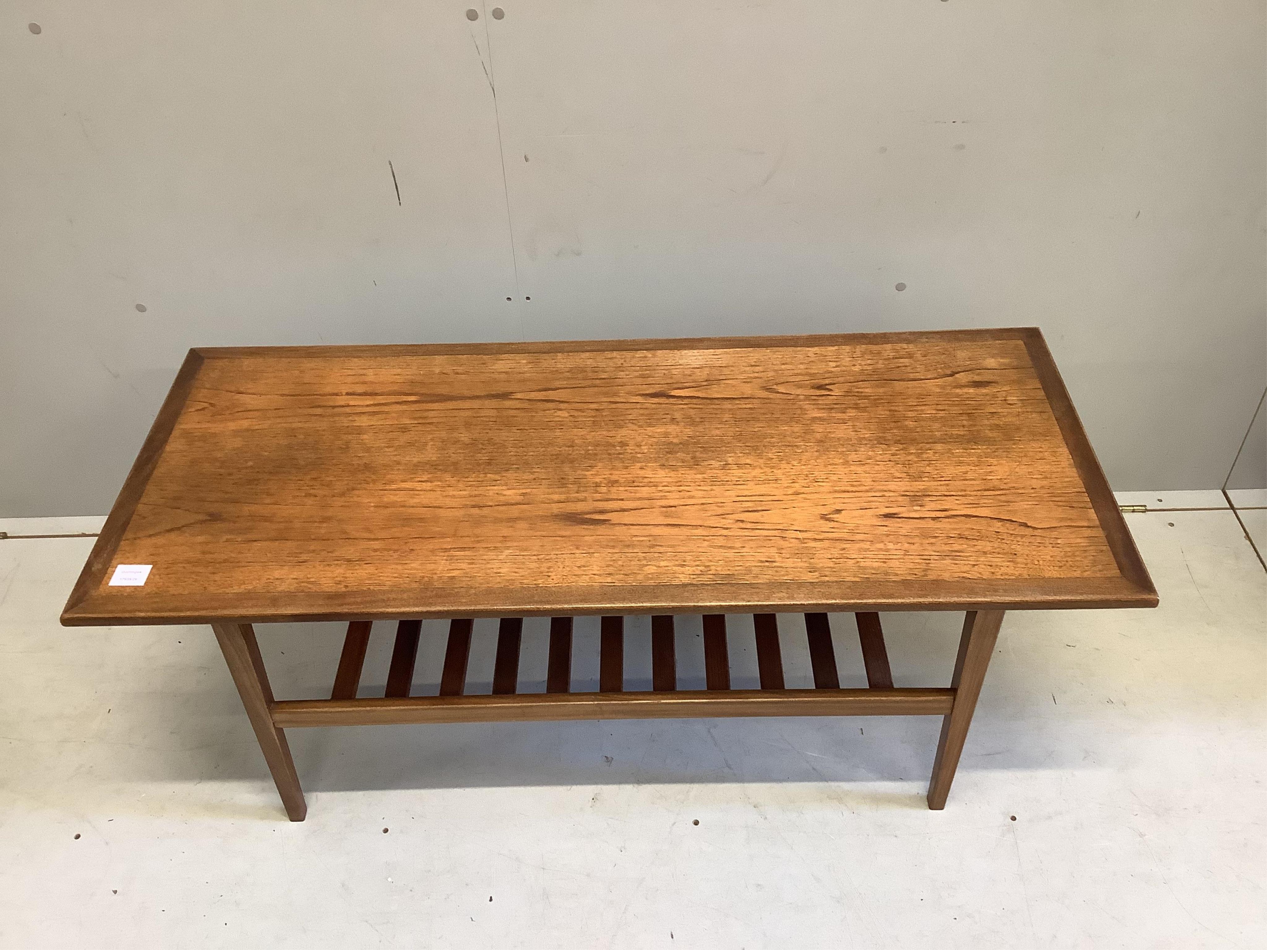 A mid century rectangular teak two tier coffee table, width 122cm, depth 51cm, height 48cm